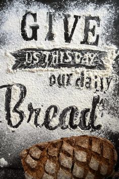 a piece of bread that is sitting on top of some kind of paper with writing on it