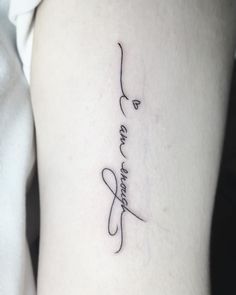 a tattoo with the word love and an arrow in cursive writing on it