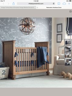 a baby's room is decorated in blue and white with stars on the wall