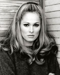 a black and white photo of a woman with long hair