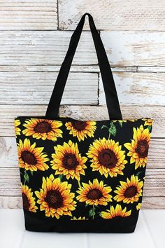 Sunflower with Black Trim Tote Bag Perfect size tote for the beach,daytrips, or for everyday!  Canvas Construction Zip Top Closure Attached 5.5" Wide x 4.25" Tall Zip Top Pouch Two Webbed Handles with 9.5" Drop 13" Wide (Bottom) x 17" Wide (Top) x 14" Tall x 4.5" Deep Pick Up Available in Itasca, Texas Over Shoulder Bag, Cheer Bag, Favorite Handbags, Zippered Tote, Cute Purses, Shoulder Purse, Black Trim, Weekender Bag, Zip Top