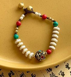 Fashion Element: Bell Style: Ethnic Style Traditional Jewelry With Sliding Knot For Festival, Traditional Sliding Knot Bracelets For Beach, Traditional Bracelets With Sliding Knot For Beach, Traditional Beaded Bracelets With Sliding Knot For Festivals, Traditional Beach Bracelets With Sliding Knot, Traditional Beaded Bracelet With Sliding Knot For Festivals, Bohemian Bracelet With Sliding Knot, Beach Festival Bracelet Jewelry, Bohemian Sliding Knot Bracelet