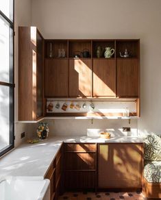 the kitchen is clean and ready for us to use it's natural wood accents