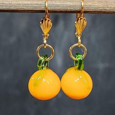 Kawaii so Cute! Orange Fruit Earrings, Glass Citrus Charms, Gold Pierced Earrings * Gold plated brass lever back ear wires * Glass oranges (citrus fruit) * Handmade using vintage glass fruit charms Please see all photos. I have one pair of these earrings. Condition: New, unworn Message me if you have any questions. Ships from California. Fun Gold Dangle Jewelry, Gold Dangle Fun Jewelry, Fun Orange Dangle Jewelry, Cute Orange Dangle Jewelry, Cute Nickel-free Orange Jewelry, Fun Orange Dangle Earrings, Fun Orange Drop Earrings, Cute Orange Drop Earrings, Gold Fun Drop Earrings