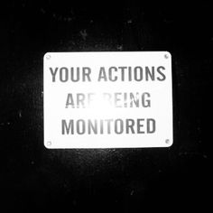 a sign that says your actions are being monitored