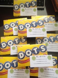 several packets of dots sitting on top of a table