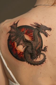 a woman with a dragon tattoo on her back