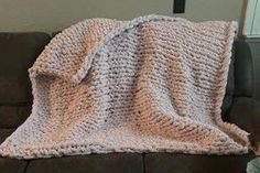 a blanket that is sitting on top of a couch