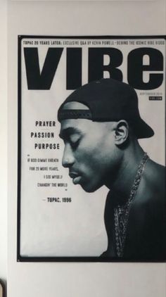 a black and white photo of a man wearing a cap on the cover of vibe magazine