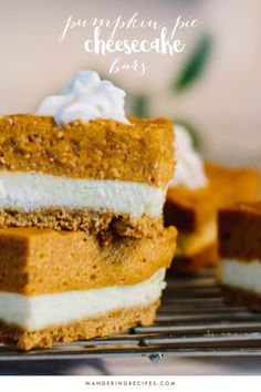 three pieces of pumpkin pie cheesecake bars on a cooling rack with the rest of the cake in the background