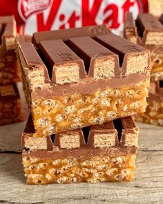 chocolate and peanut butter bars stacked on top of each other in front of a candy bar