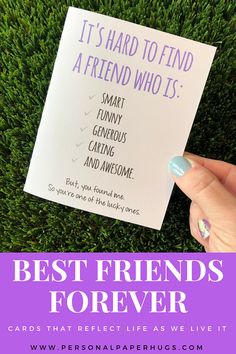 someone is holding up a card with the words best friends forever written on it in front of some green grass