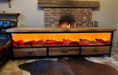 a fire place in the middle of a living room next to a couch and fireplace