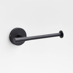 an image of a black toilet roll holder on the wall in front of a white background