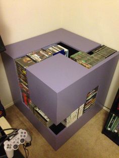 an entertainment center made out of bookshelves and video games