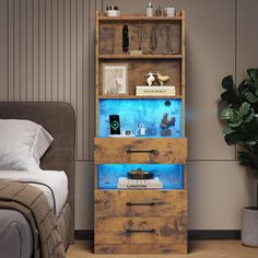 a bed room with a neatly made bed and a tall wooden book shelf filled with books