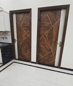 two wooden doors in the middle of a kitchen