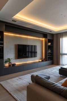 a living room with a couch and television on the wall