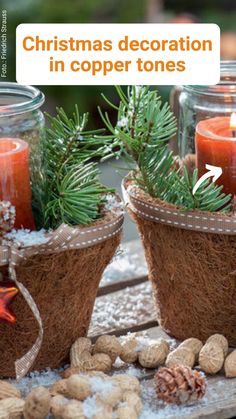 two baskets filled with pine cones and candles