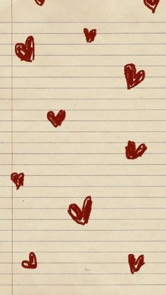 a piece of lined paper with hearts drawn on it