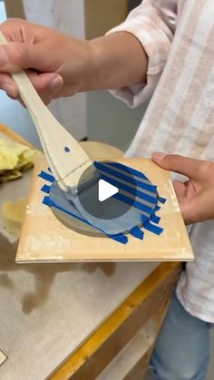 a person using a spatula to cut bananas