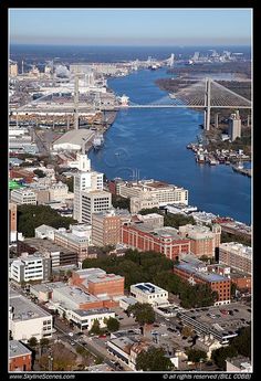 an aerial view of the city and river