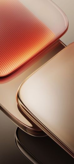 the back side of an iphone phone with gold and red designs on it's sides