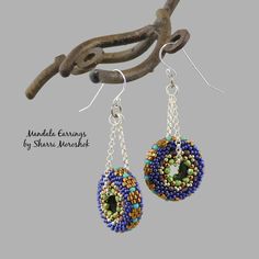 "Mandala earrings are my original design, handstitched beaded beads. Made with tiny glass seed beads and crystals, this pair is done in a deep, rich, eclectic color combo of cobalt blue and bronze with accents of amethyst puple, green and turquoise. The little mandalas hang about 1.5\" on silver chain from sterling silver ear wires. Each mandala measures about 1 inch in diameter. They are very light weight, swingy and fun to wear. Will arrive sweetly packaged in an organza pouch. Give the gift o Handmade Bohemian Crystal Earrings With Czech Glass, Handmade Bohemian Czech Glass Crystal Earrings, Handmade Round Czech Glass Beaded Earrings, Beaded Mandala, Circle Mandala, Mandala Earrings, Dangle Earrings Boho, Earrings Circle, Wearable Art Jewelry