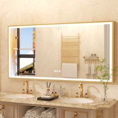 a bathroom with two sinks and a large mirror over it's sink area,