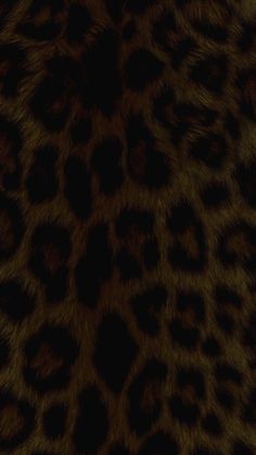 an animal print pattern is shown in dark brown and black colors on a fur background