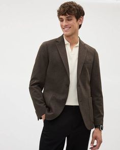 Made in a stylish textured knit, this slim-fit blazer is just what you need to elevate your everyday style all while enjoying absolute comfort.  - Stretch textured knit: contains 30% recycled polyester* - Lined - Slim fit through the chest and waist - Notch collar - Two-button closure - Chest pocket - Side patch pockets - Inner pockets - Buttoned cuffs - Double back vent - Sleeve length: 35.25'' from center back (size 40) - Centre back body length: 29" (size 40)  * This garment contains recycled Outfits With Blazers, Mens Knit, Slim Fit Dress Shirts, Slim Fit Blazers, Clothing Men, Fitted Dress Shirts, Knit Blazer, Notch Collar, Sports Blazer