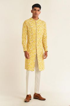 Marigold cotton silk kurta with all over floral jaal print and thread embroidered border. Paired with pant cut pyjama.
Components: 2
Pattern: Embroidered
Type Of Work: Thread and Sequin Work
Neckline: Round Collar
Sleeve Type: Full Sleeves
Fabric: Cotton Silk
Color: Yellow
Other Details: 
Side slits
Kurta Closure: Front loop buttons
Occasion: Sangeet,Mehendi and Puja - Aza Fashions Yellow Floral Print Kurta For Diwali, Unstitched Yellow Kurta With Block Print, Cotton Kurta With Block Print For Wedding, Cotton Kurta With Printed Motifs For Wedding, Cotton Block Print Kurta For Wedding, Yellow Floral Print Kurta, Cotton Traditional Wear With Floral Print For Wedding, Wedding Cotton Kurta With Floral Print, Designer Cotton Silk Kurta With Floral Print