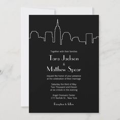 a black and white city skyline wedding card