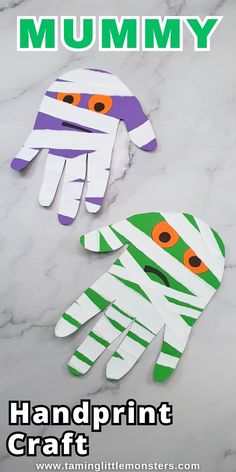 two handprinted paper crafts with the words mommy on them and an image of a monster