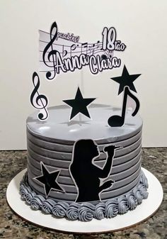 a birthday cake decorated with musical notes and stars