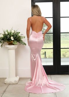 Our 'Touch of Glamour' Satin Gown will ensure that you're the belle of the ball. This stunning style features a plunging V neckline that will accentuate your bust while making your waist look cinched. 'Touch of Glamour' features an open ruched back, thigh high spilt and train for added drama that will keep everyone's eyes on you. Satin fabric Plunging V neckline Open ruched back Thigh high spilt Our model is DressMeZee model is Nina is 5ft6' and wears a size XS. Formal Dresses With Train, Pink Formal Prom Dress, Pink Open Back Dress, Tight Fit Prom Dresses, Pink Satin Maxi Dress, Prom Dresses Low Back, Grad Ball Dress, Pink Silk Prom Dress, Light Pink Prom Dress Long