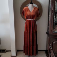 Stunning Rust Velvet Dress. It Has A Gorgeous V Neckline With Bell Shoulders. The Back Is A Slightly Deeper V With Ties. It Has An Elastic Waist And It Can Be Camouflaged With Any Kind Of Belt. It Is Just Beautiful. The Belt Is Not Included. Rust Velvet Dress, Rust Bridesmaid Dress, Beachy Dresses, Black Maxi Skirt, Maxi Bridesmaid Dresses, Bow Detail Dress, Rust Dress, Blue Maxi, Pleated Maxi Dress