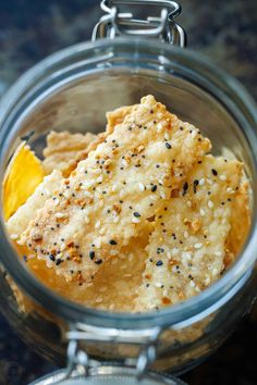 a glass jar filled with food on top of a table