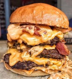 a cheeseburger with bacon and melted cheese