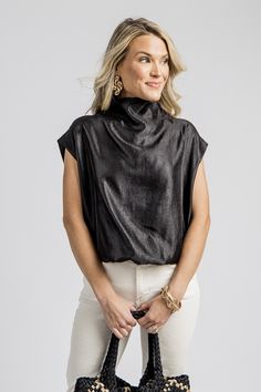 This top has a gorgeous shimmering metallic finish that allows you to dress it up or down. It features a beautiful drapey fit with a chic mock neckline and on-trend dropped shoulders. The elasticized bubble hem creates a blouson shape. Complete the look with our “Bubble Hem Skort, Black” for a fabulous date night or gameday outfit! also offered in camel Lined Back zip closure Elasticized hemline Fabric content: Self- 84% rayon, 10% polyester, 6%... Bubble Hem, Blue Door, Gameday Outfit, Mock Neckline, Center Stage, Boutique Clothing, Cute Dresses, Date Night, Camel