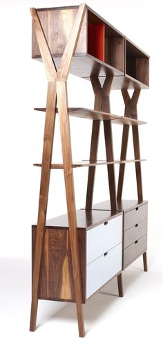 a wooden shelf with drawers and shelves on it's sides, in front of a white background