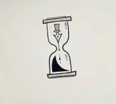 an hourglass drawing on a white wall