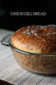 a loaf of bread sitting in a glass dish