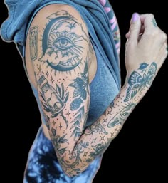 a woman with tattoos on her arms and arm