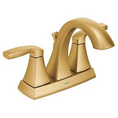 a gold faucet with two handles