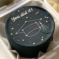 a birthday cake in a box with the words you did it