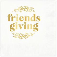 a napkin with the words friends giving written in gold foil on it, and an olive branch