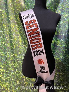 a black mannequin with a white ribbon around it's neck and the words sage canyon 2012 on it