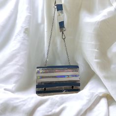 "Y2K-Inspired Vinyl and Leather Recycled Material Shoulder Bag Purse Gave myself the challenge to create a Y2K-inspired bag using/recycling scraps only and this is the final result! Blue/White/Clear Vinyl and Leather  8\"L x 5\"W x 2.5\"D Silver Chain and Vinyl Strap Strap measures 33\" 2 Snap Closure One of a Kind! When you support a small business, you support a dream! Love the item but not the price? Make an offer!" Blue Rectangular Upcycled Shoulder Bag, Concert Bags, Vinyl Bag, Business Card Case, Leather Card Case, Essential Bag, Red And Black Plaid, Clear Vinyl, Blue Ink