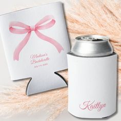 a can cooler with a pink ribbon on it